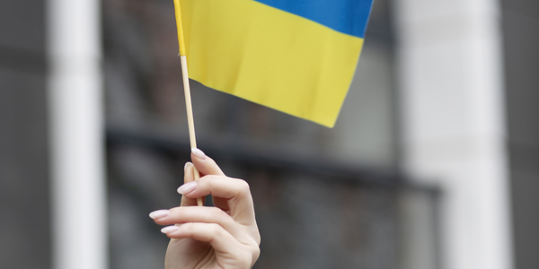 person-holding-ukrainian-flag.jpg