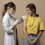 medium-shot-smiley-girl-getting-vaccinated.jpg
